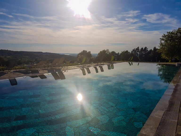 scenic-view-swimming-pool-against-sky-sunset